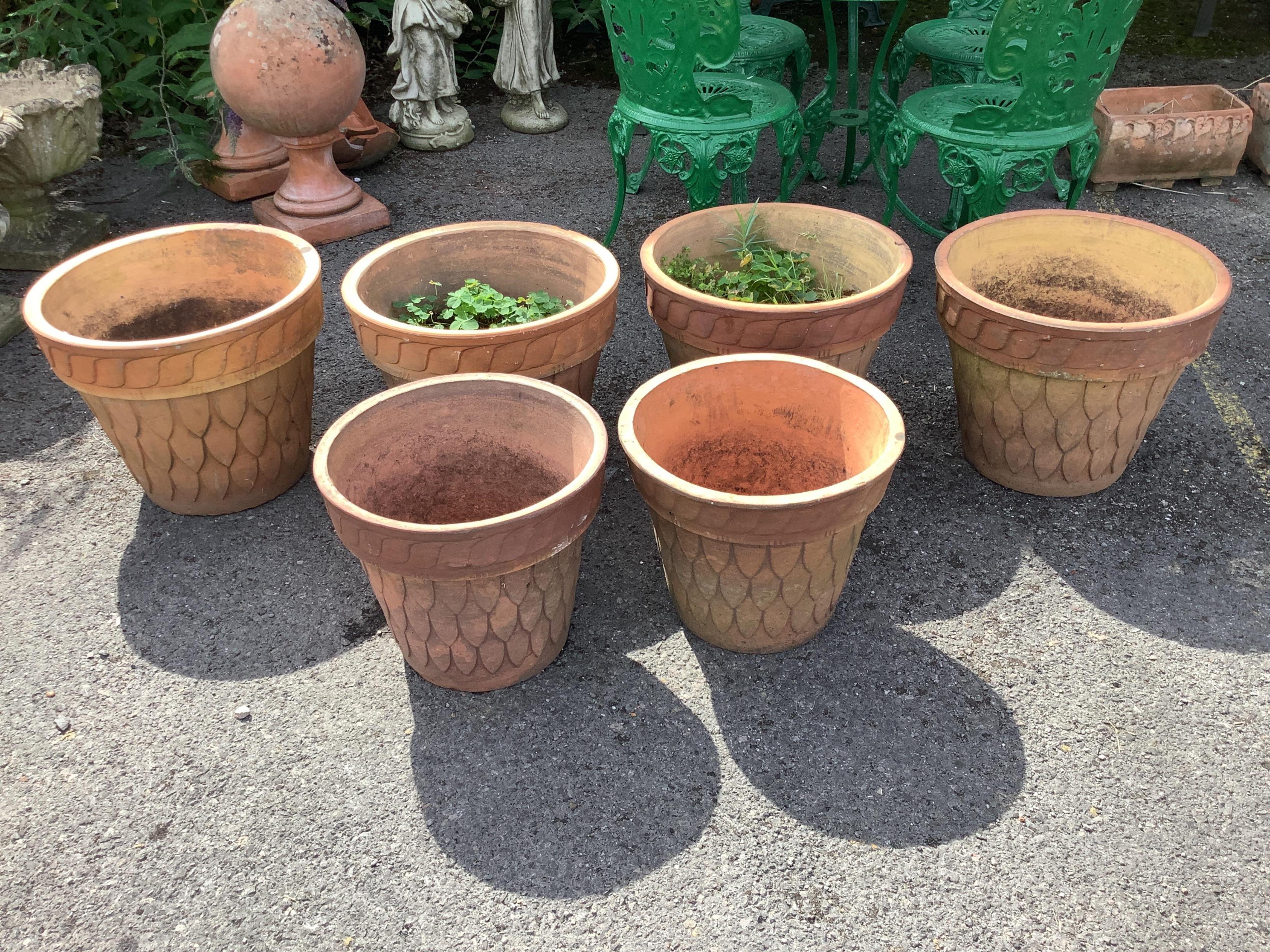Six (four plus two) circular terracotta planters, largest diameter 44cm, height 35cm. Condition - fair